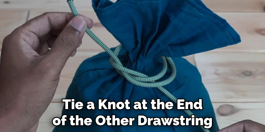 Tie a Knot at the End of the Other Drawstring