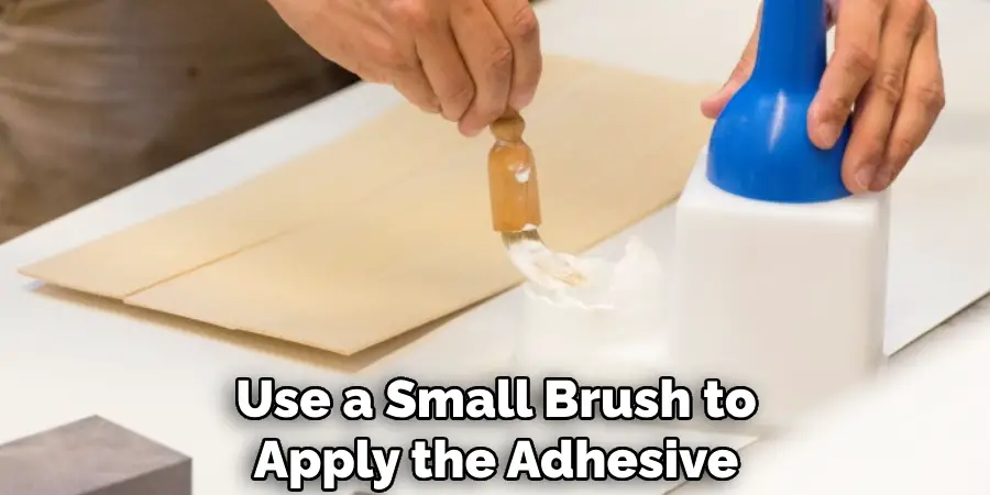 Use a Small Brush to Apply the Adhesive