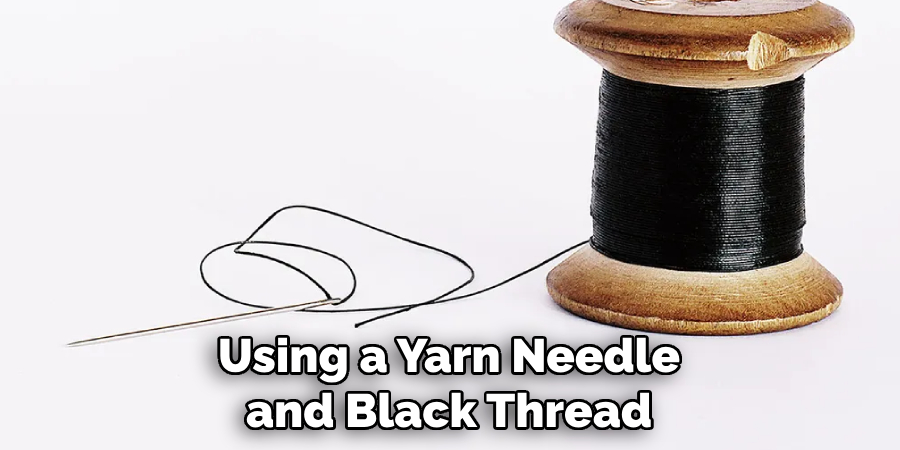 Using a Yarn Needle and Black Thread