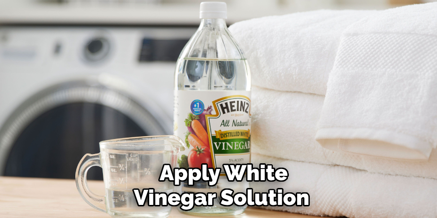 Apply White Vinegar Solution
