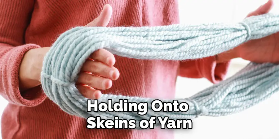 Holding Onto Skeins of Yarn