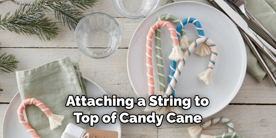  Attaching a String to 
Top of Candy Cane