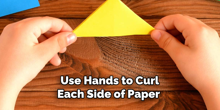 Use Hands to Curl
Each Side of Paper 
